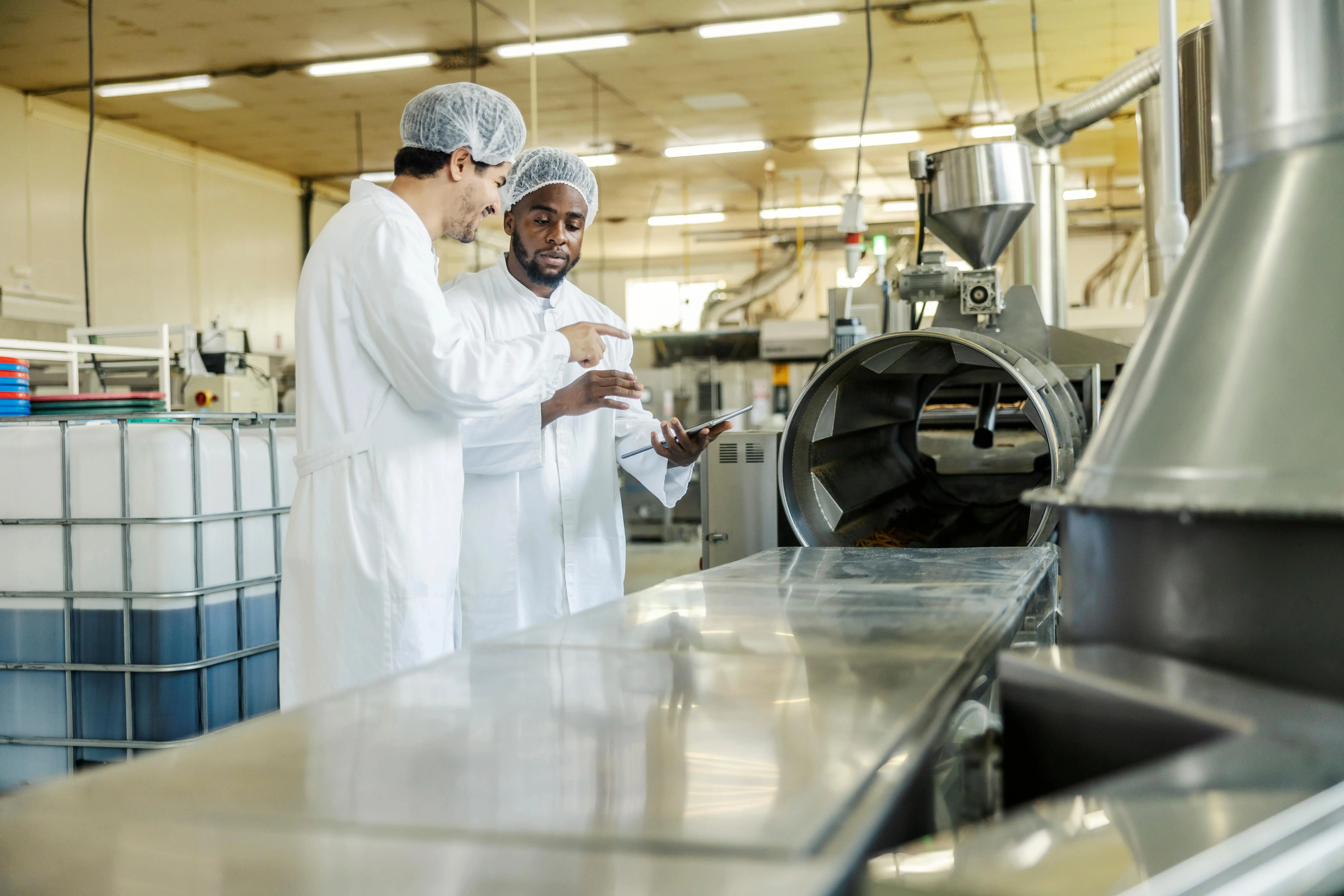 Two men in a food factory