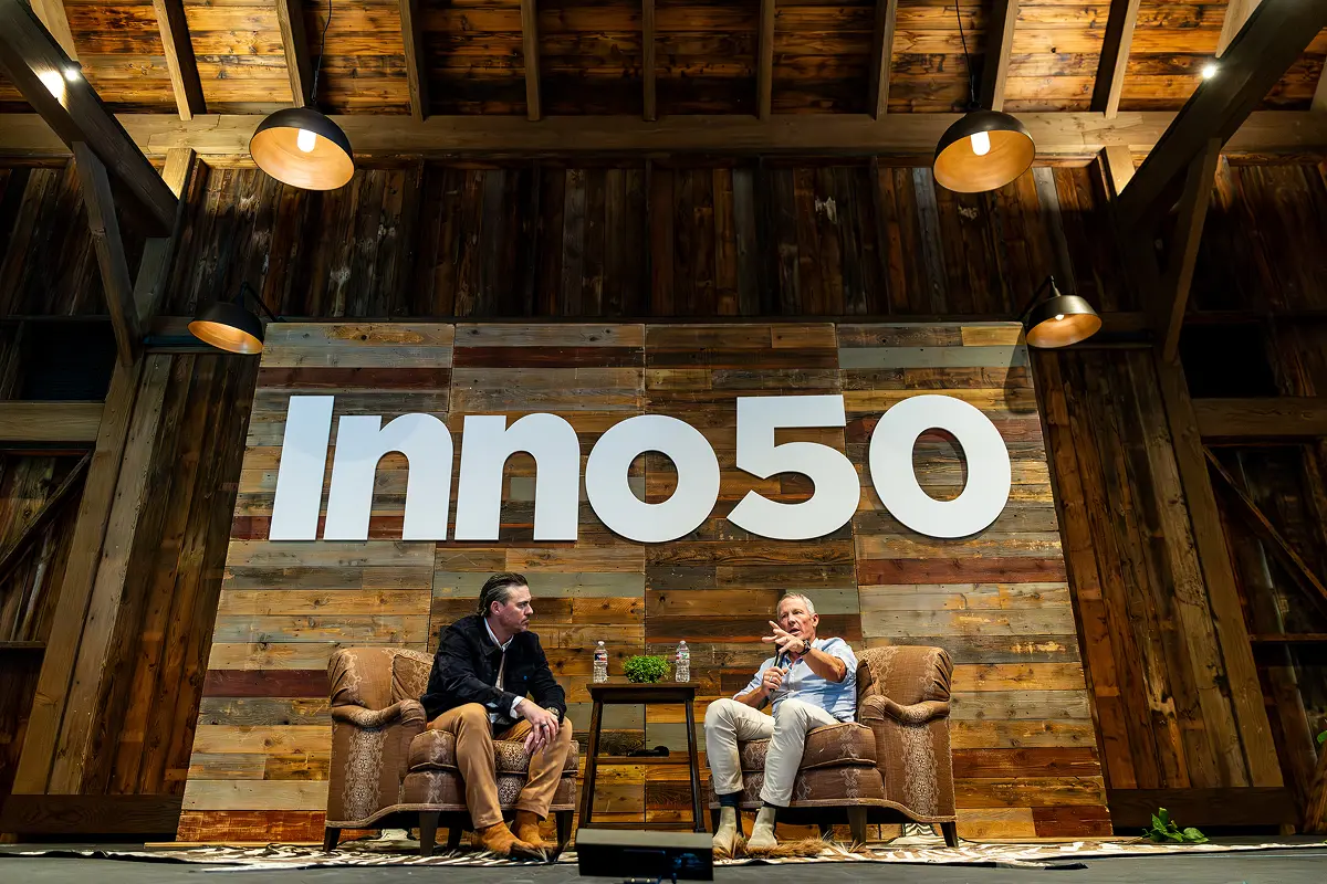 Two people talking on the stage