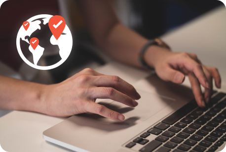 Person using laptop with an icon overlayed that displays a globe with location markers placed around it. In each marker is a checkmark, symbolizing the locale being tested.