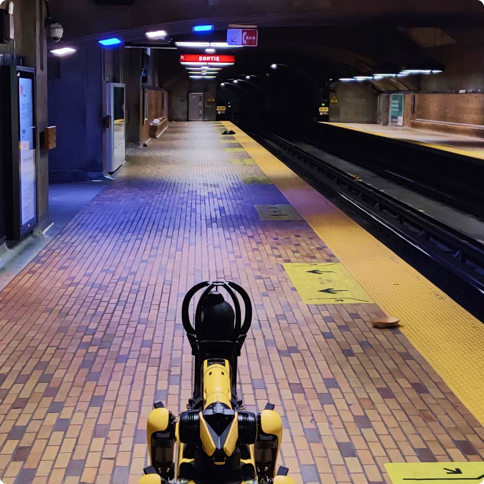 Back of Boston robotics Spot robot in a Montreal metro station.