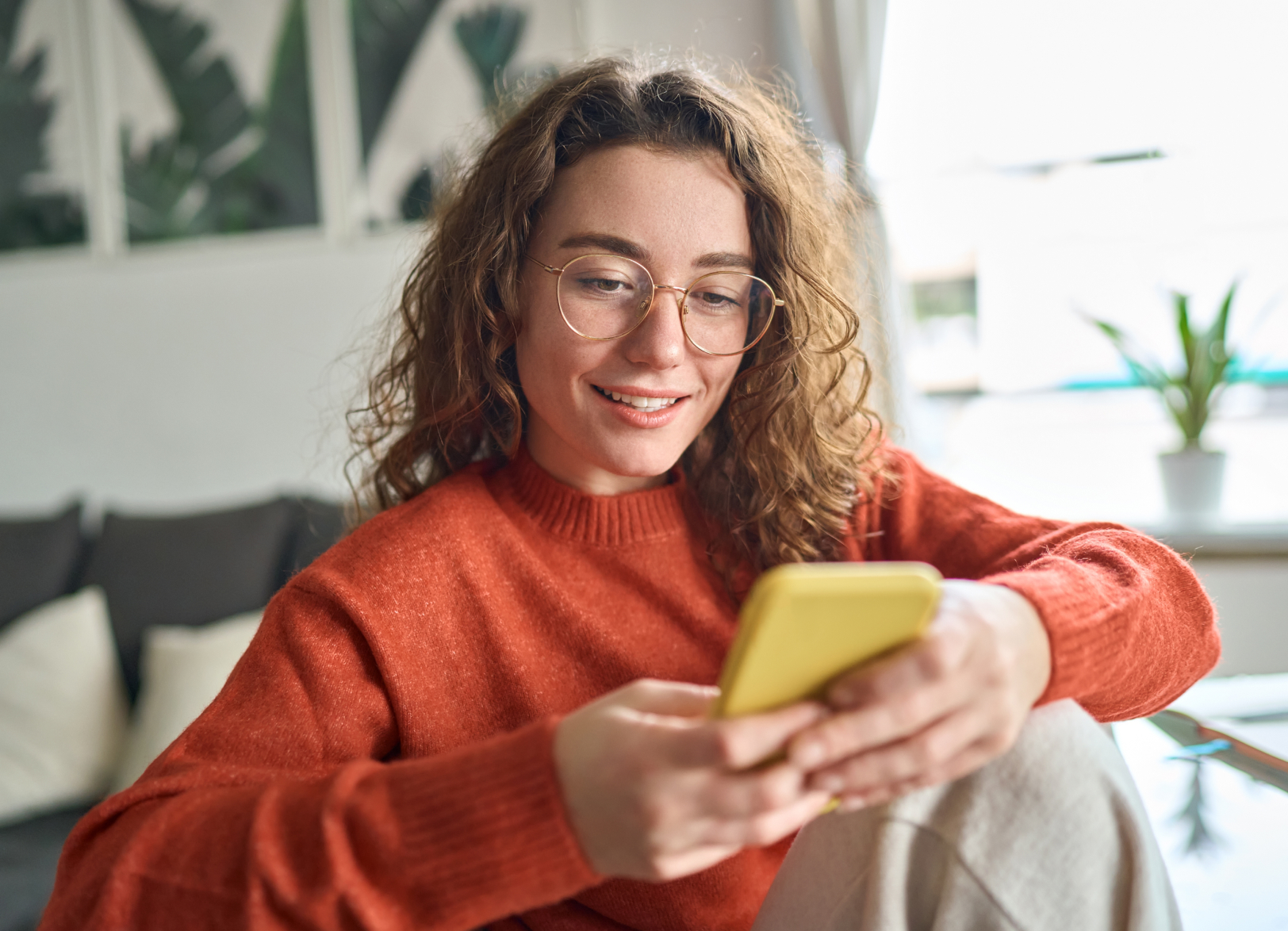 Young adult looking at her mobile phone