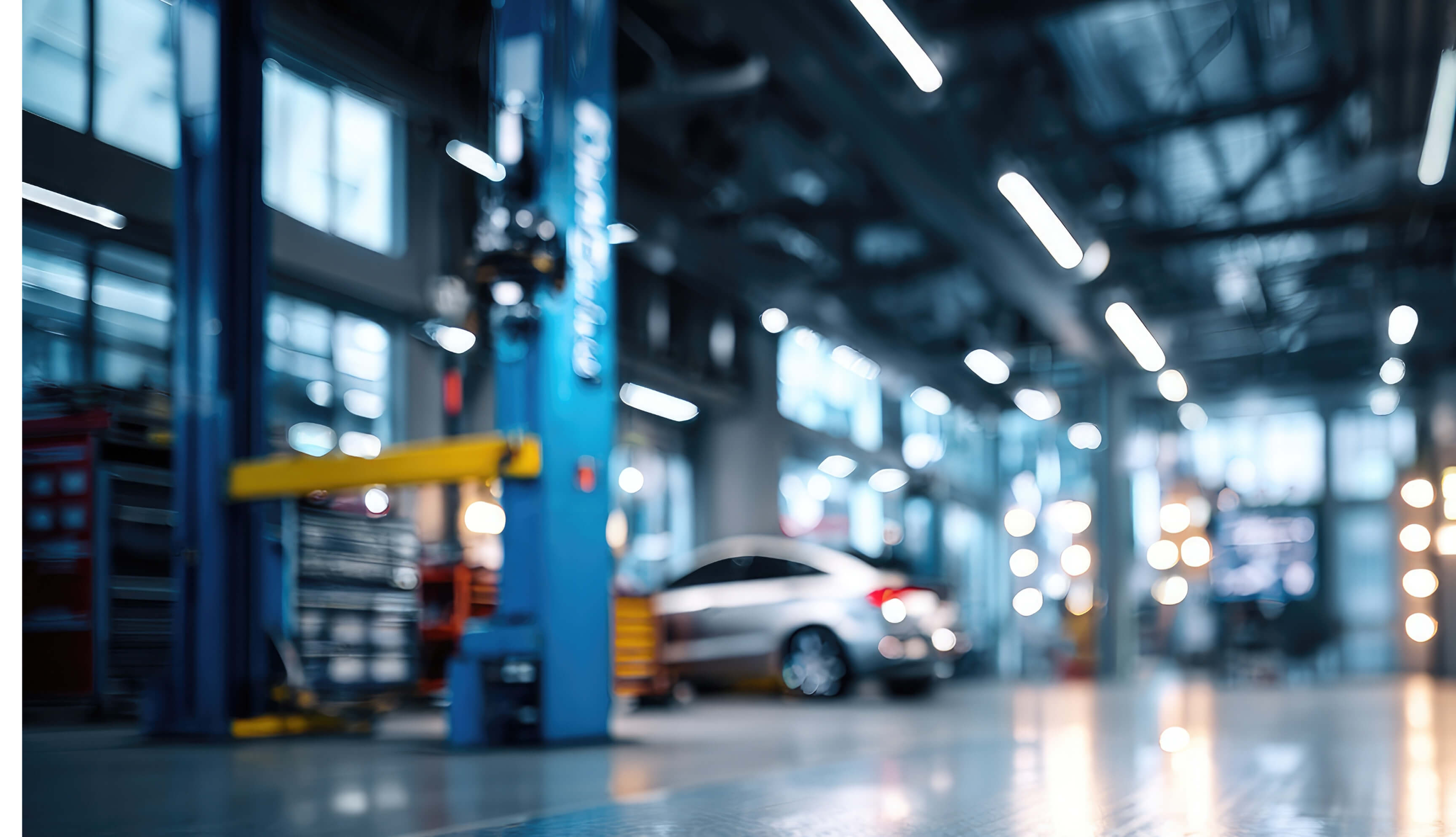 Interior blurry view of a commercial garage.