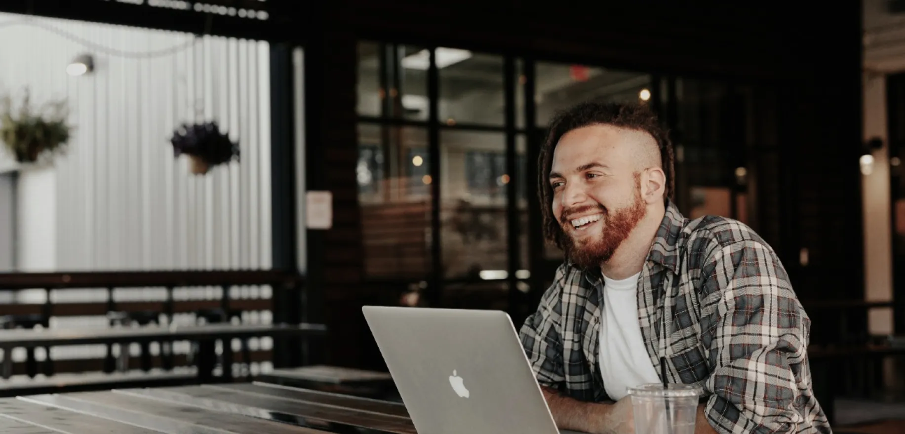 Photo of a guy smiling with laptop