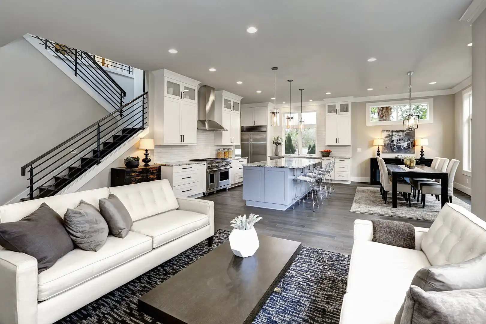 Callahan & Peters open-concept kitchen remodel with a custom island, white cabinetry, and modern living space.