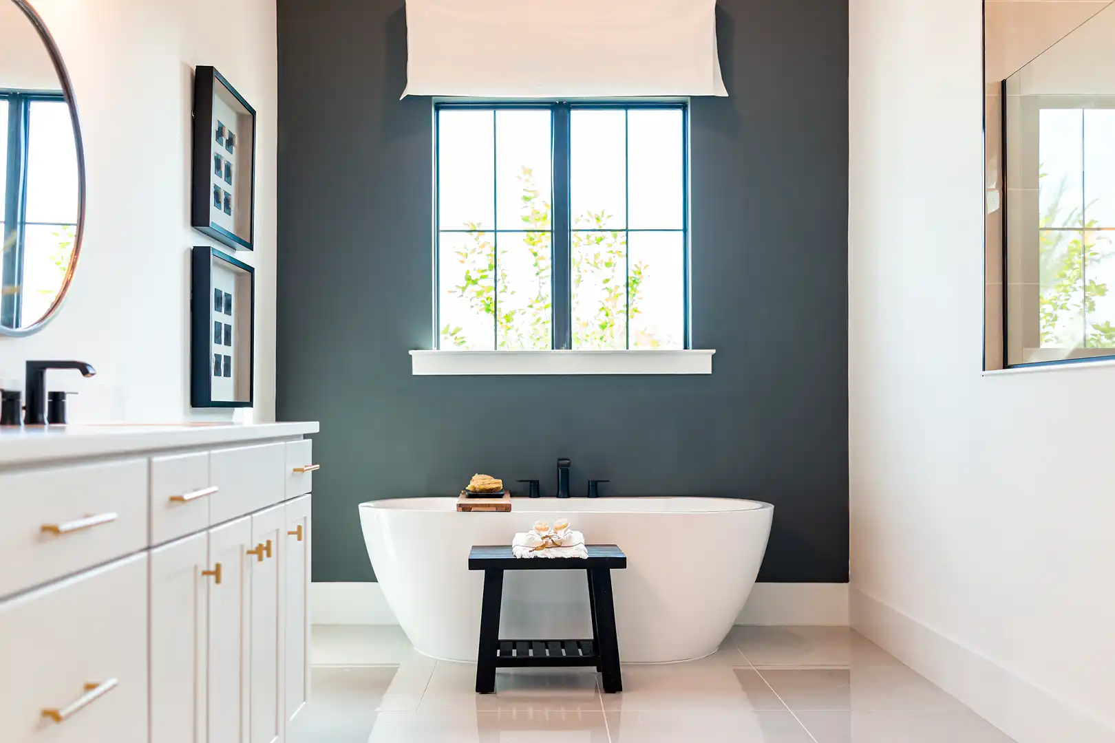 Callahan & Peters luxury bathroom remodel with a freestanding soaking tub, modern vanity, and elegant finishes.