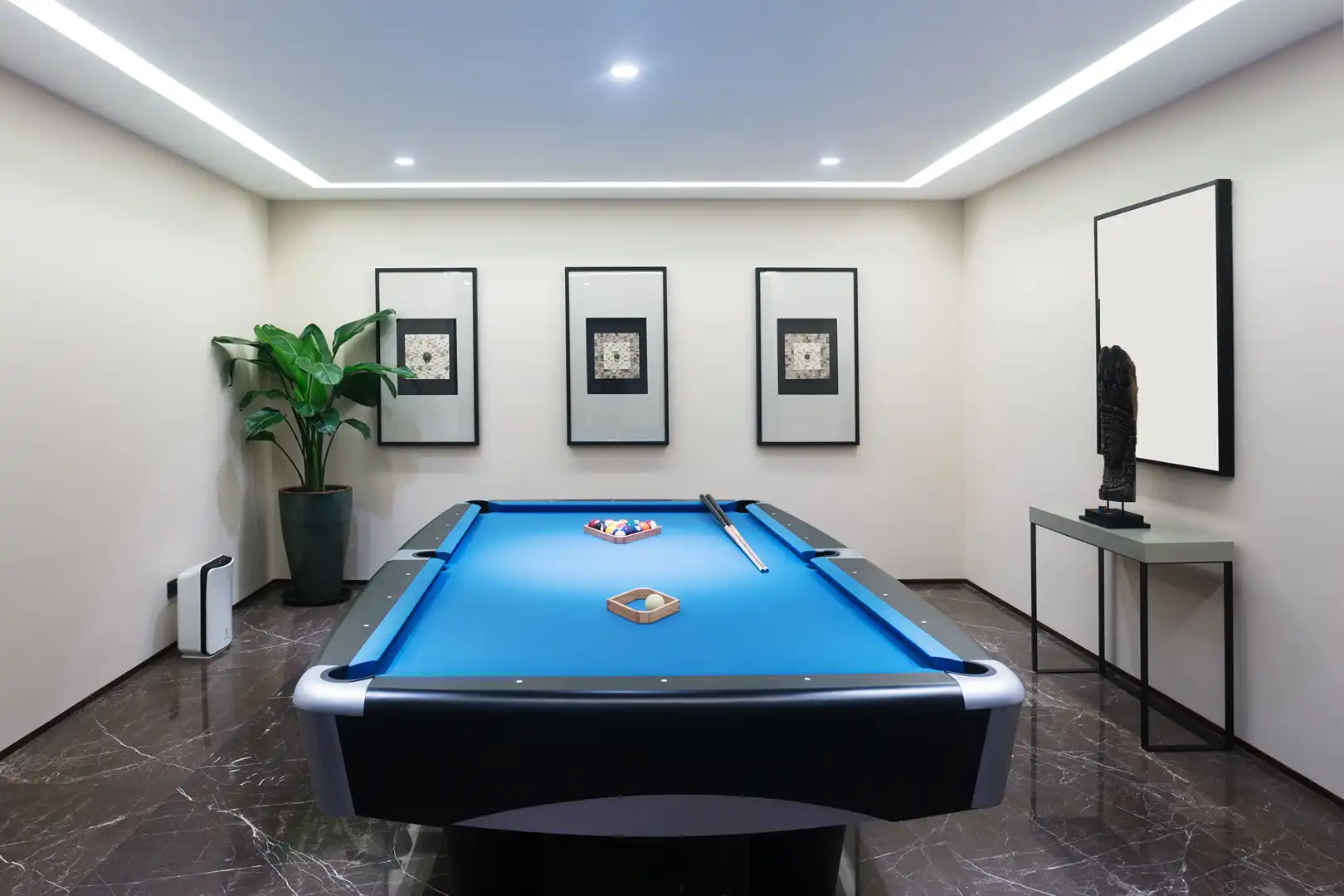 Callahan & Peters custom basement remodel with a modern game room, pool table, recessed lighting, and luxury finishes.