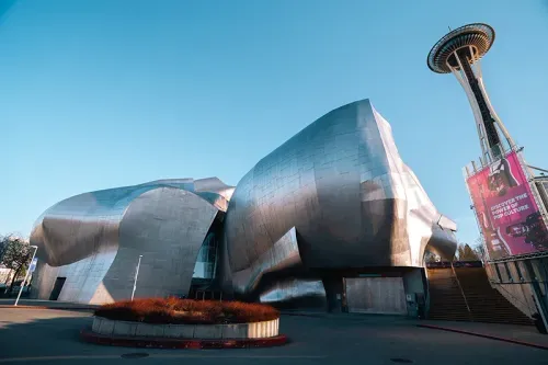 MOPOP silver exterior, the Space Needle, and a roundabout in front