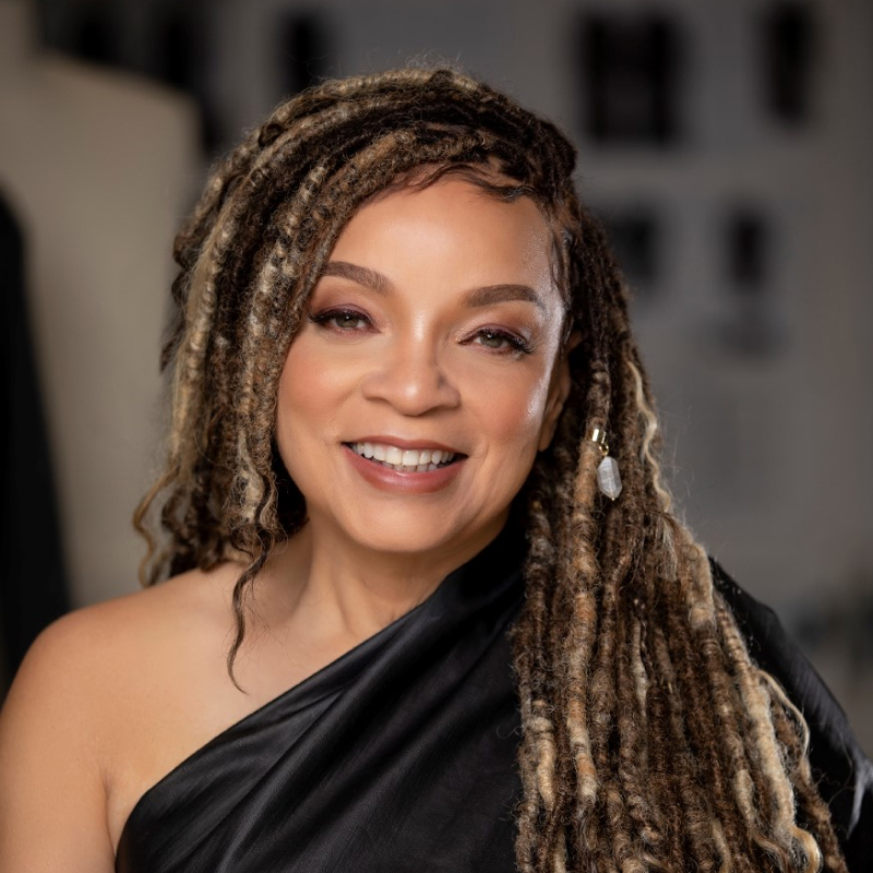 Ruth E. Carter, a black woman wearing an off-shoulder black dress