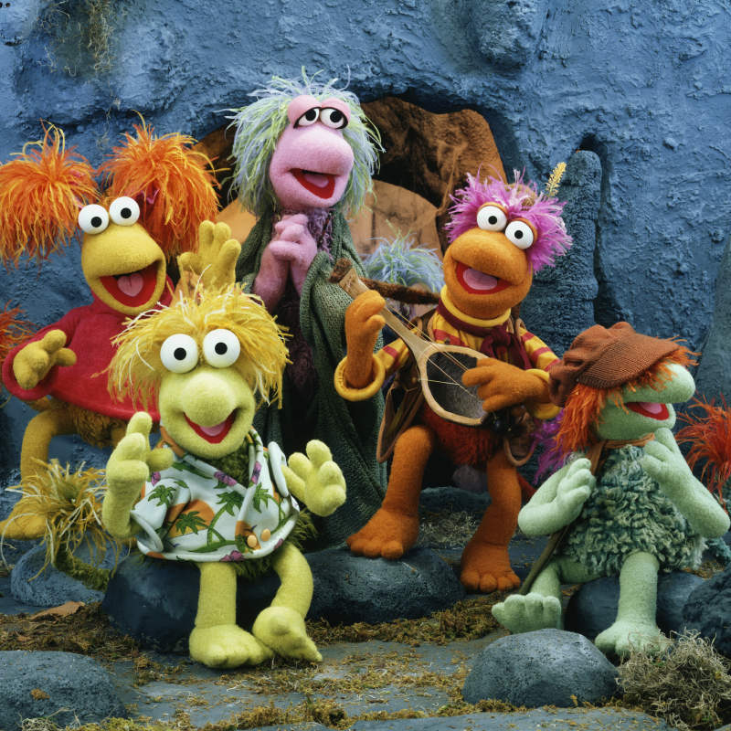 Colorful muppets playing instruments