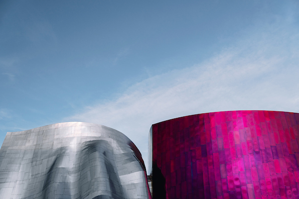 Silver and purple buildings against a blue sky