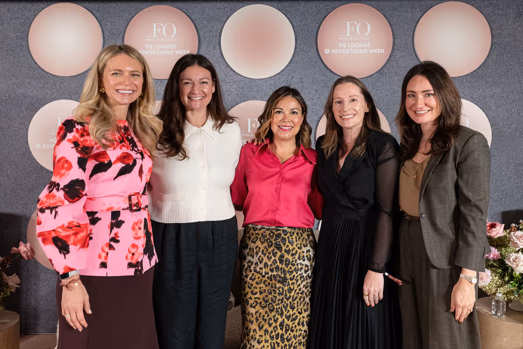 Five women leaders pose together at the FQ Lounge during Advertising Week, smiling confidently in front of a branded backdrop.