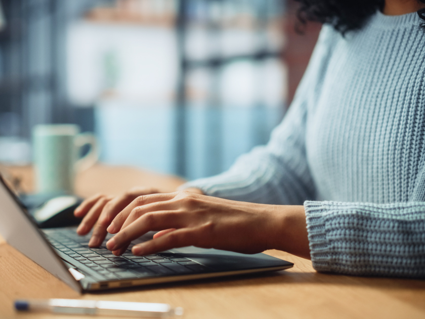 Software engineer working at a laptop, representing the shift from individual code authorship to AI-assisted development at technology companies