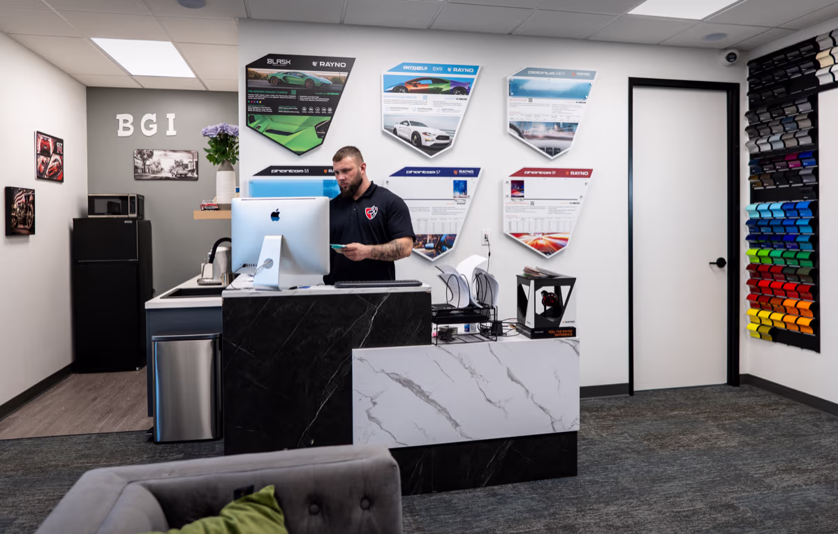 Bugai Pro Auto Detailing reception desk with lounge area and product displays
