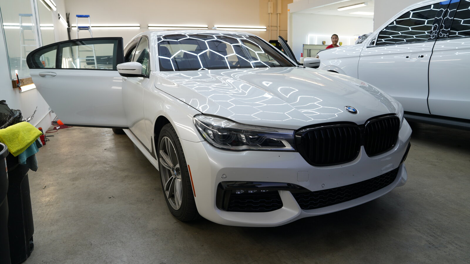 Window tint installed on a white BMW 7 Series at BGI Pro Auto Detailing in Sacramento