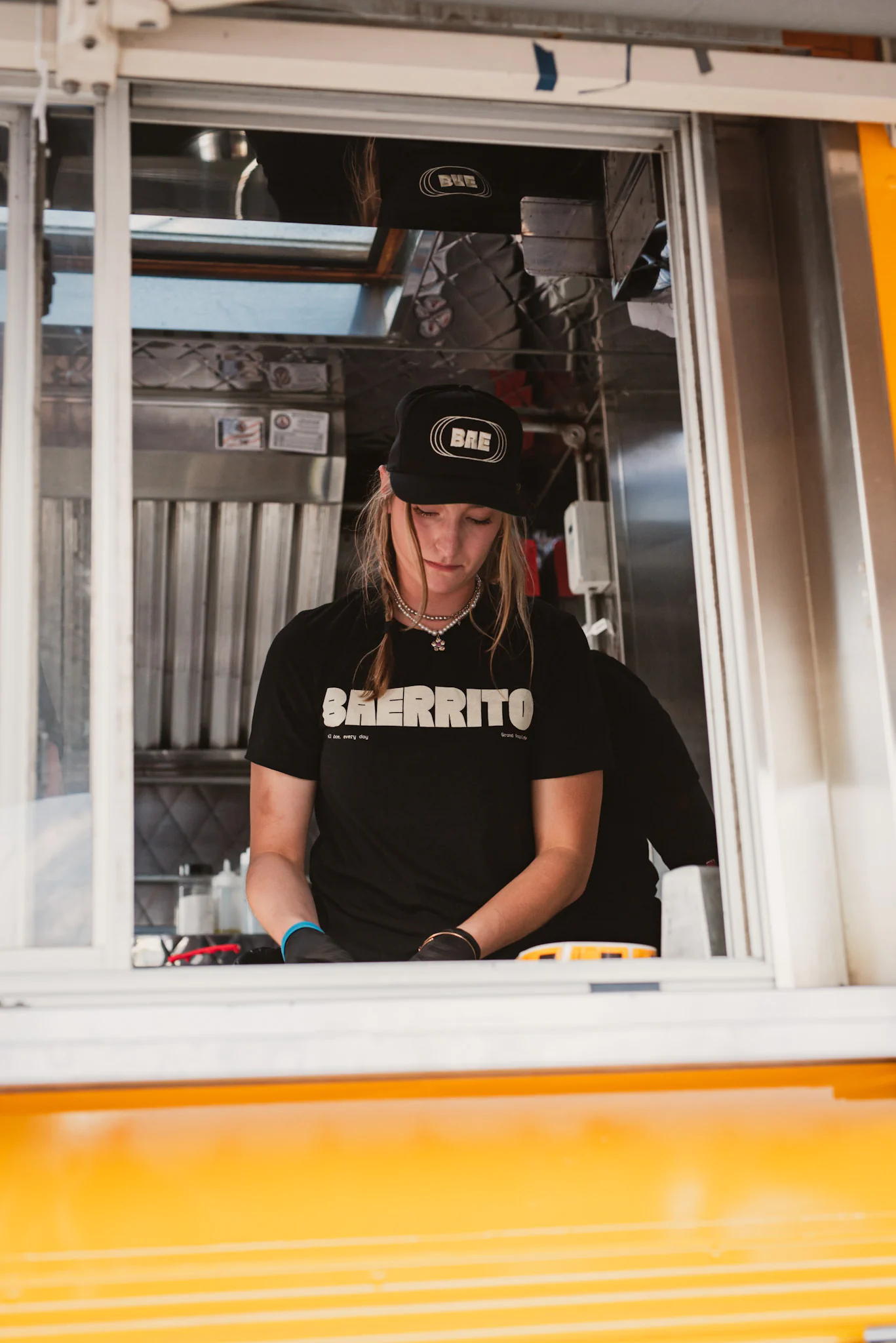 Baerrito employee preparing food
