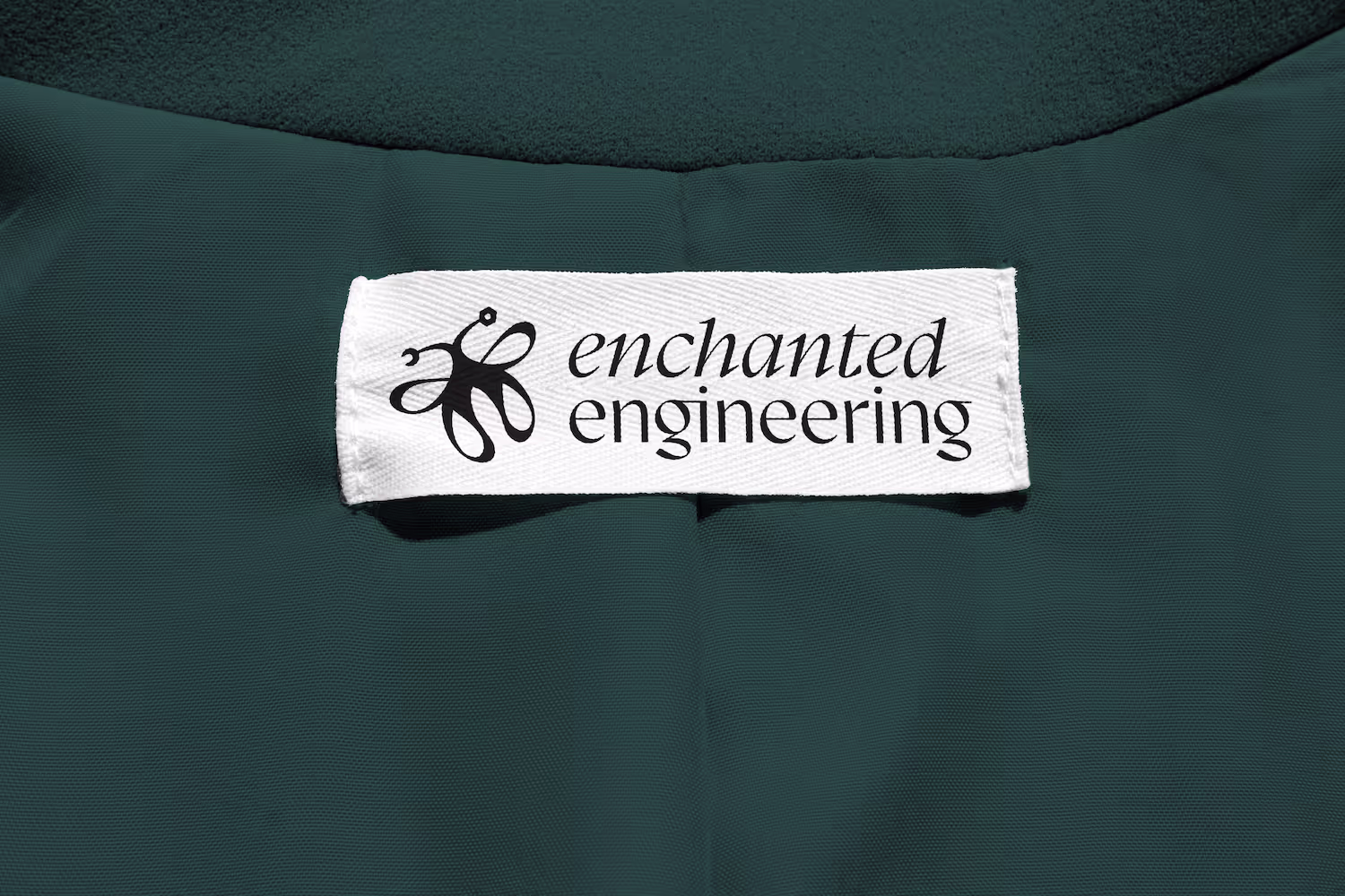 Logo on the clothing label of a teal jacket
