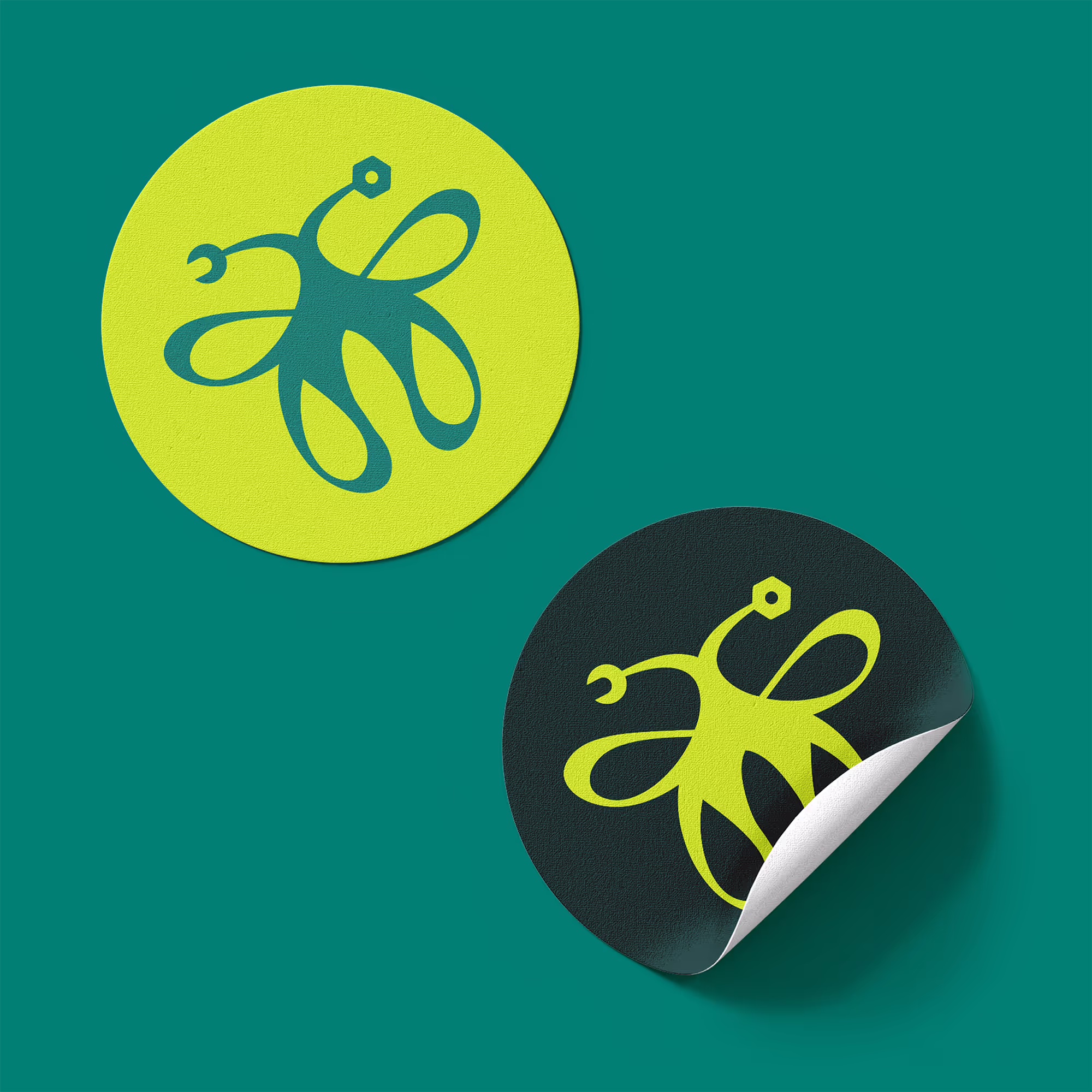 2 stickers with butterfly logo mark. Top one has yellow-green background with a dark green logo. The bottom is the inverse.