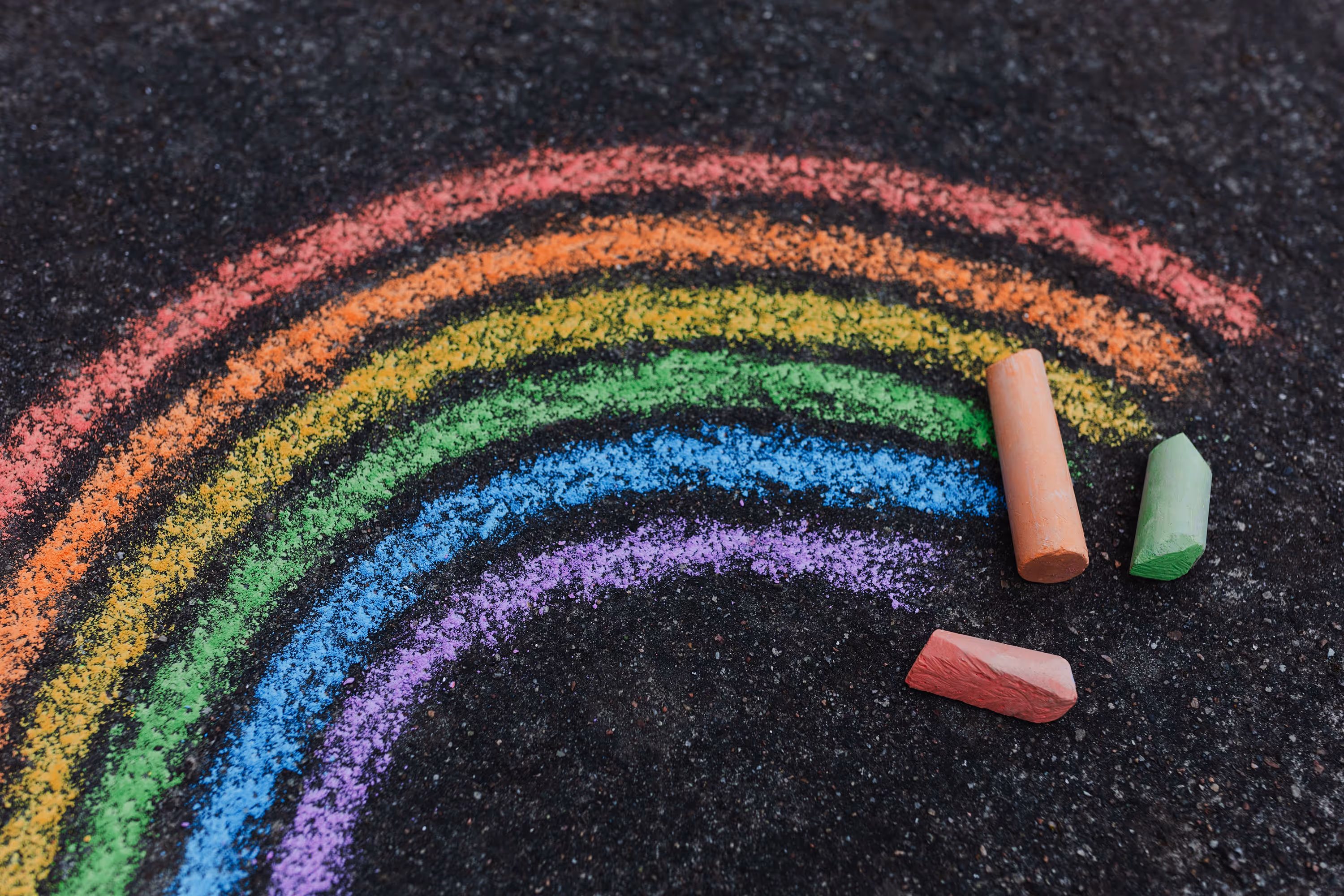 A chalk drawing of a rainbow.