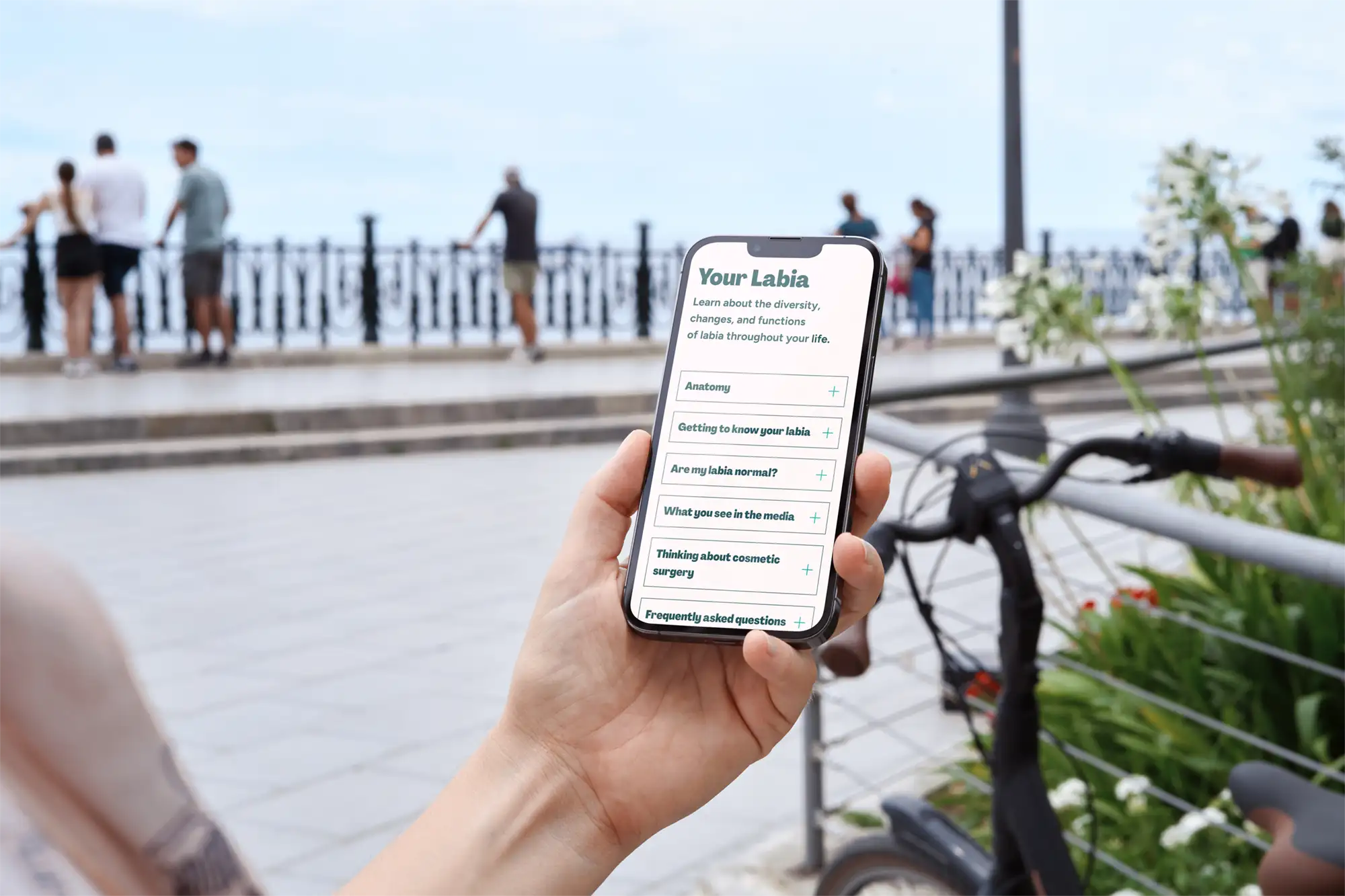 Person outside looking at information page.