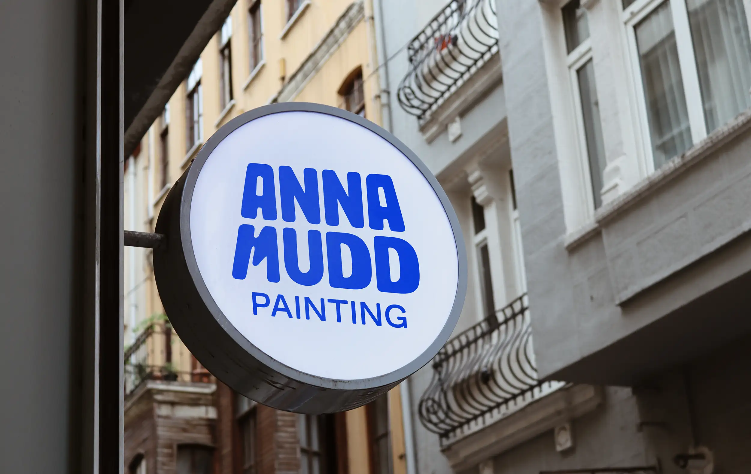 Circle sign with Anna Mudd Painting logo