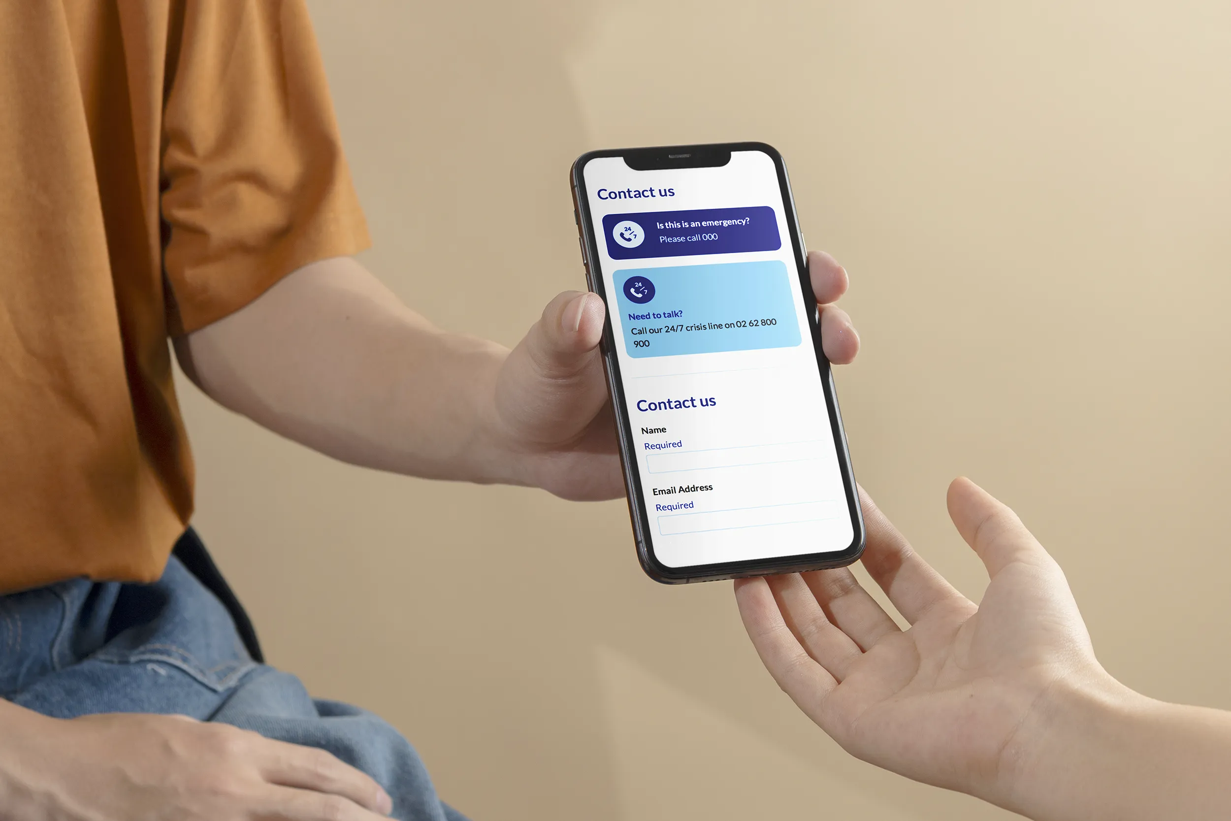 A person showing their friend the contact information for DVCS
