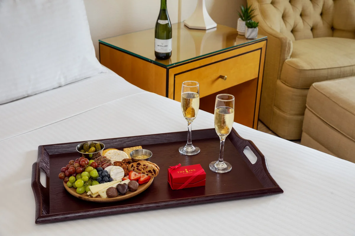 Champagne and treats in bed