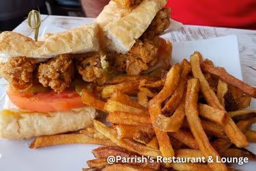 Parrish's Restaurant & Lounge Po Boy sandwich with fries