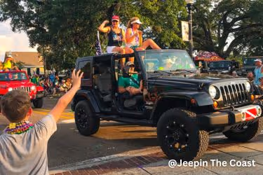 people sitting in a Jeep