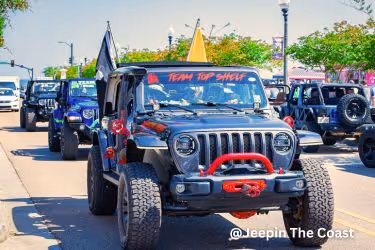 Jeeps parading in the street