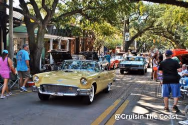 Classic cars driving through the city
