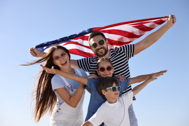 Family holding the USA flag