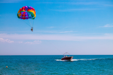 Someone parasailing over the coast