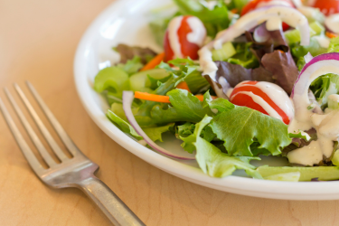 Salad with dressing on a plate