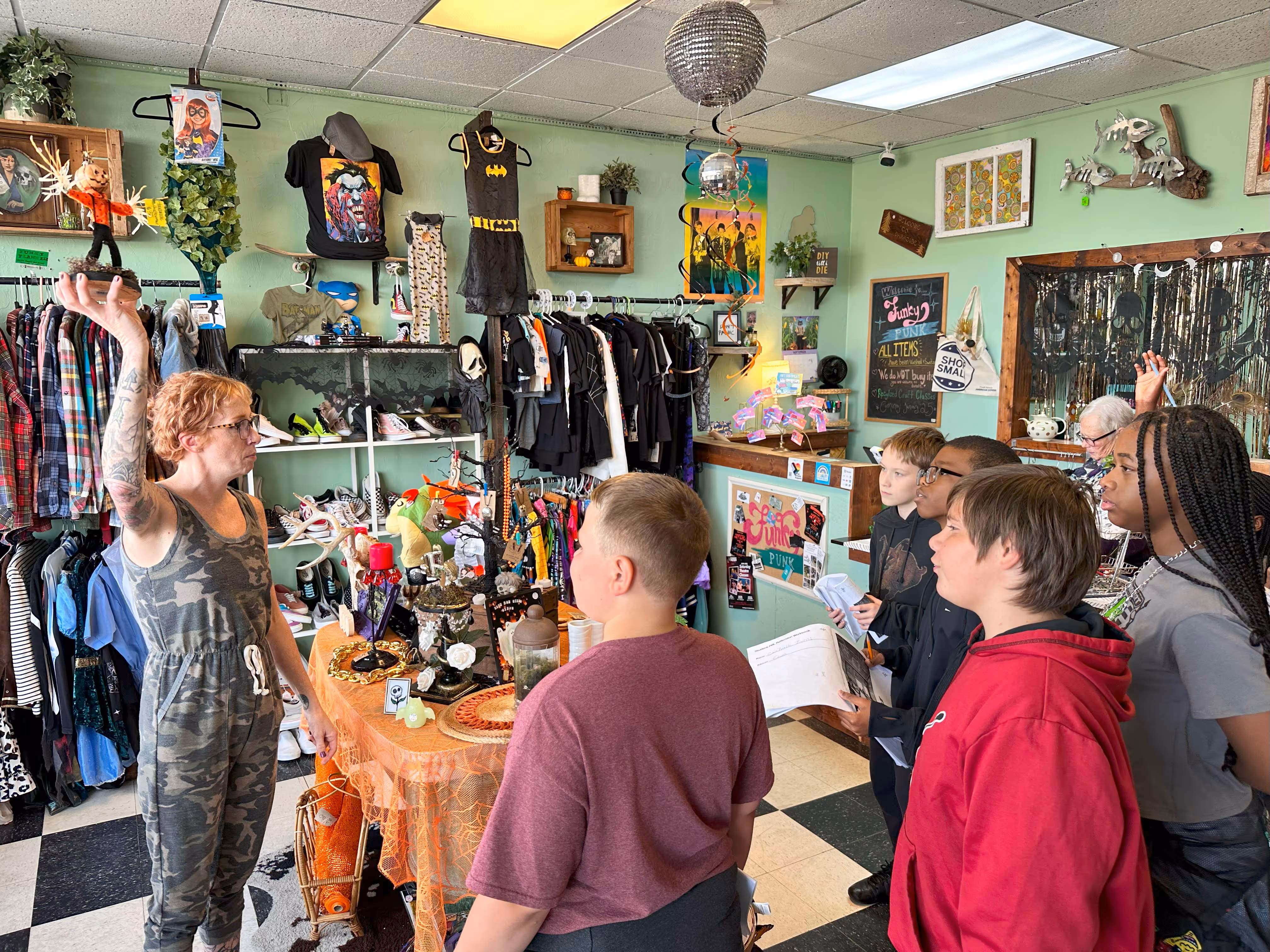 Students on a field trip to a vintage clothing store.