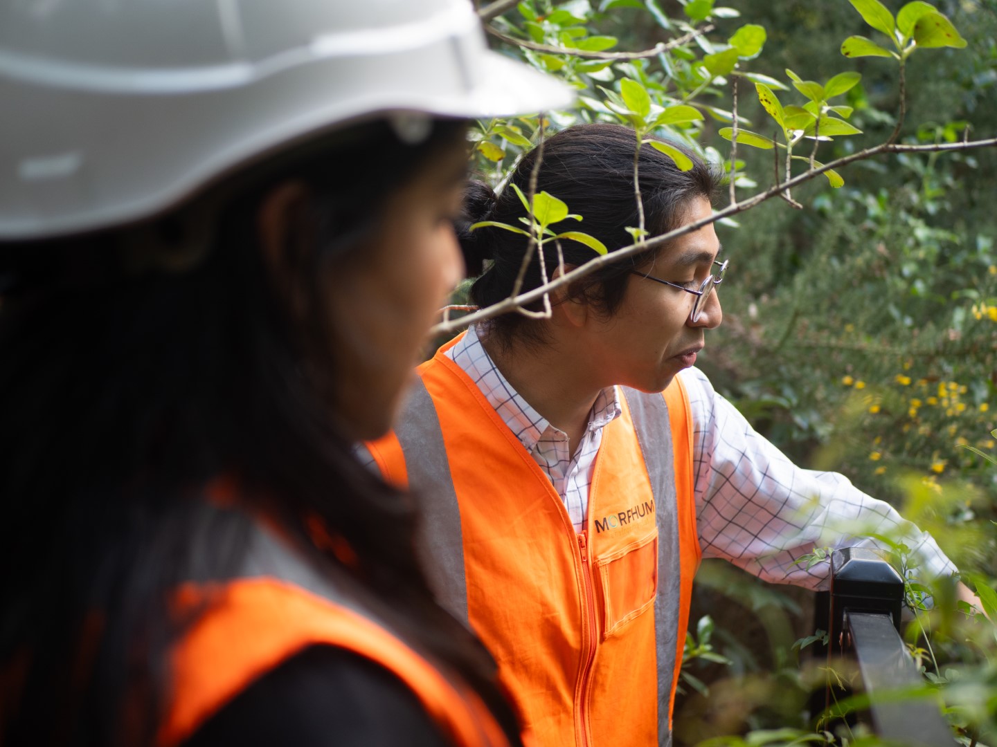 Two environmental engineers working on-site to assess the outcomes of a climate adaptation opportunity project to improve the resilience of a community wastewater system in New Zealand