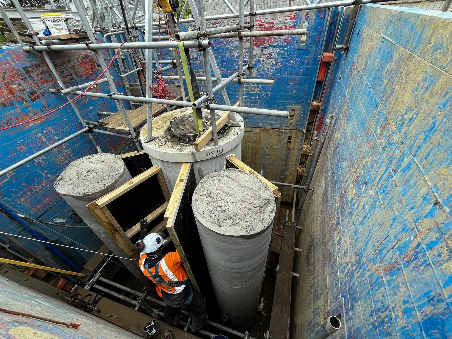 A Morphum Environmental engineer assessing the construction of a nature-based stormwater discharge design in New Zealand