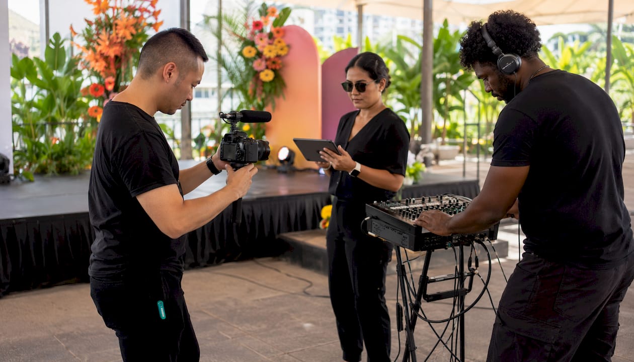 Video crew preparing cameras at event