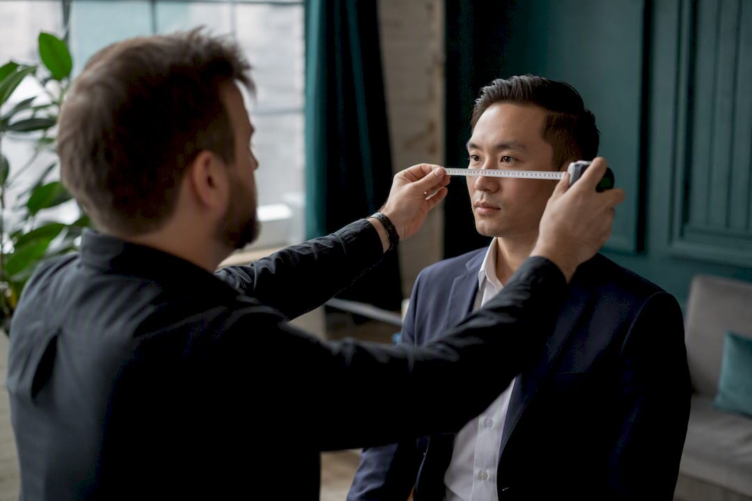 Photographer measuring eye line on subject