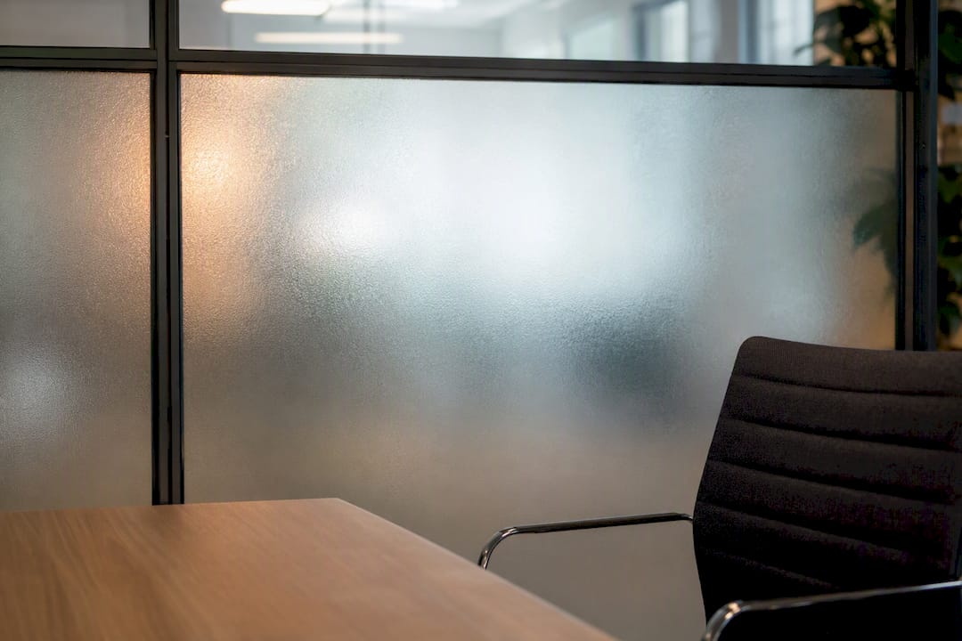 Frosted glass wall as photo backdrop in office