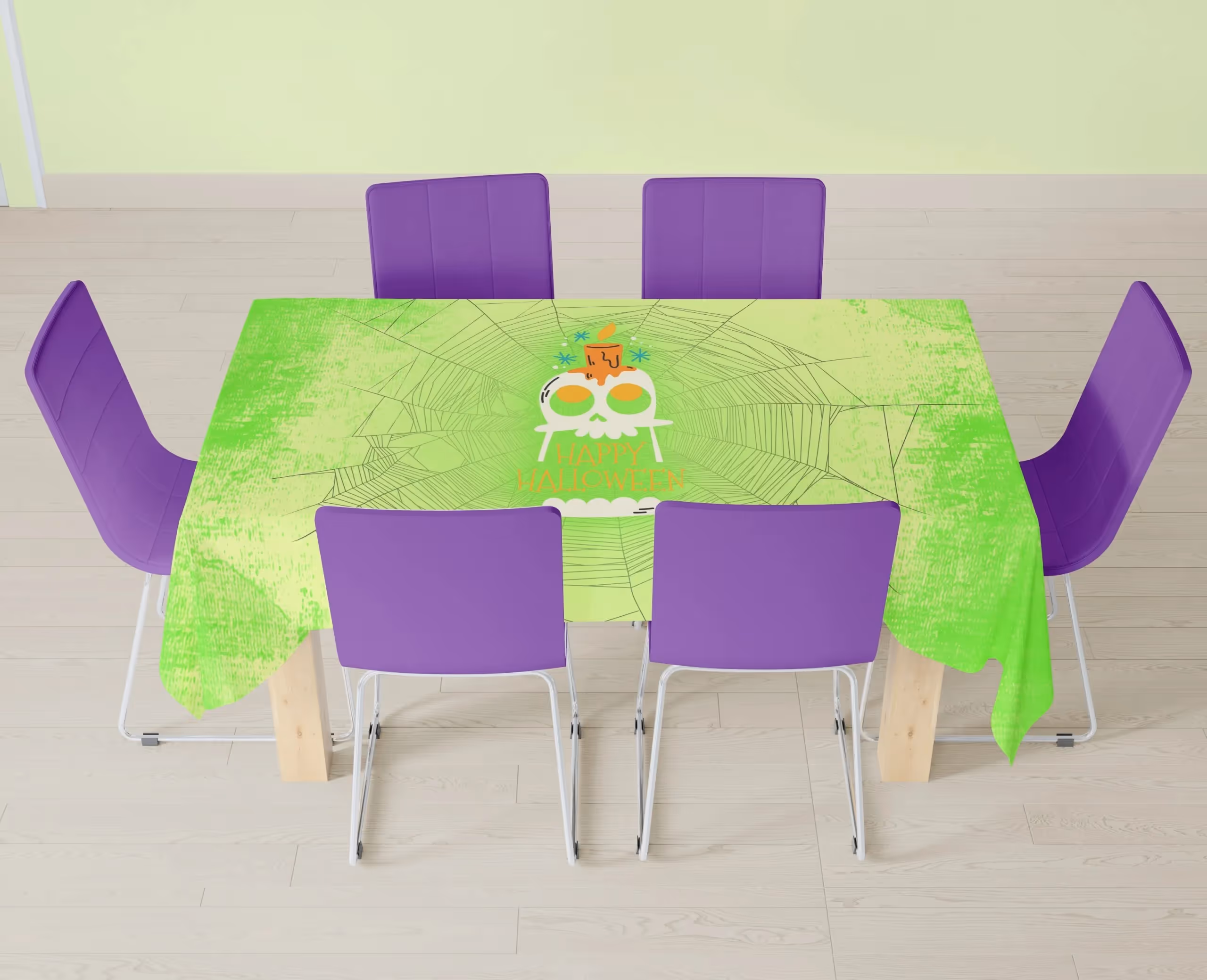 Green tablecloth with a skull in the center and spiderwebs all over the rest of the cloth