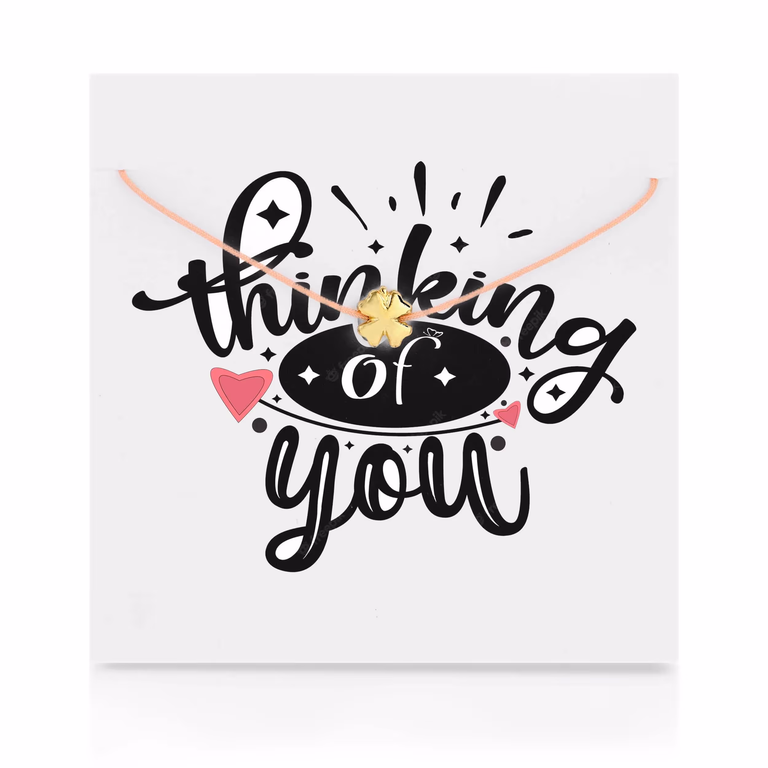 Carded jewelry with thinking of you on it with a gold clover necklace in the front