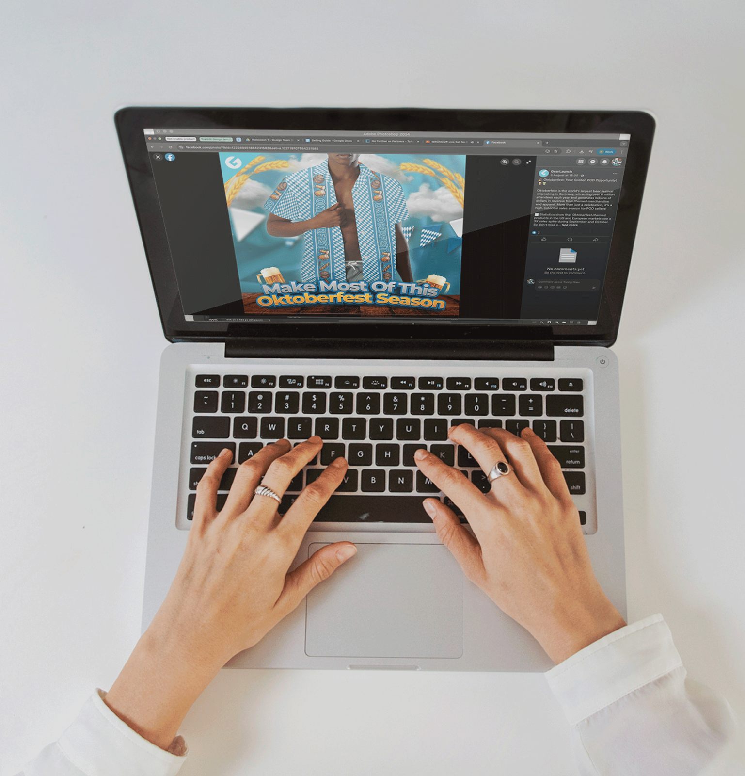 Hands typing on a laptop showing an Oktoberfest selling guide with blue and white Bavarian-pattern apparel design on screen.
