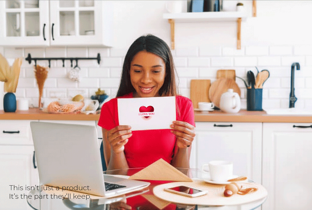 Smiling woman opening an ‘I Love You’ card at home – meaningful Grandparents Day gift idea for personalized print-on-demand products