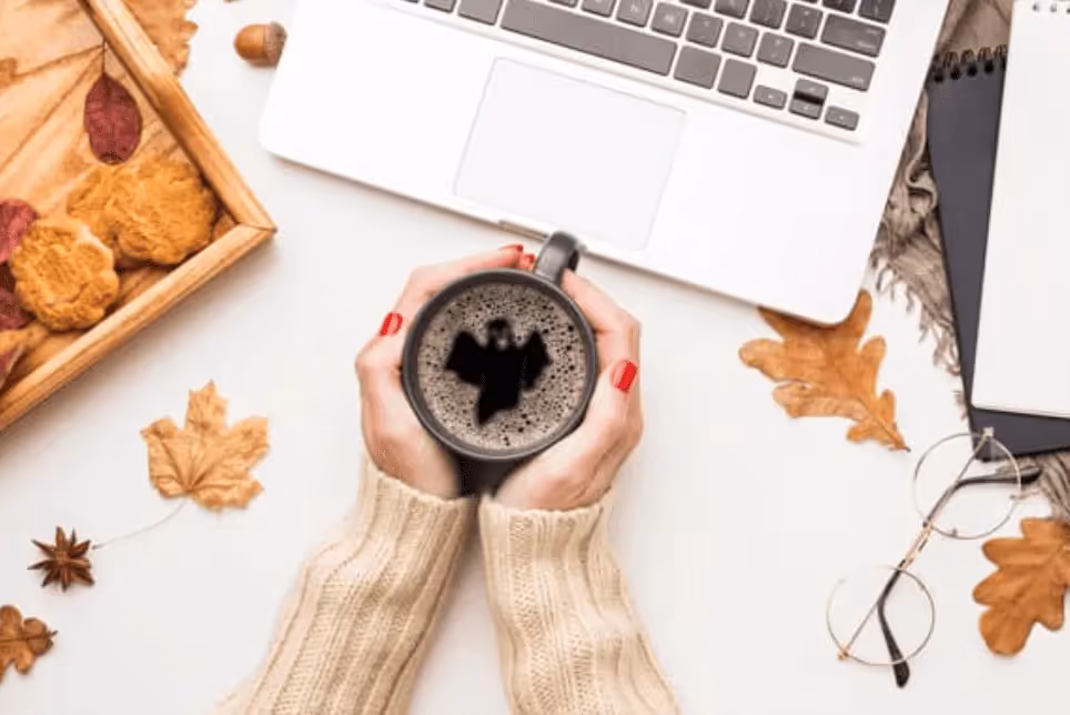 Halloween-themed coffee mug with bat latte art on International Coffee Day – October POD design inspiration