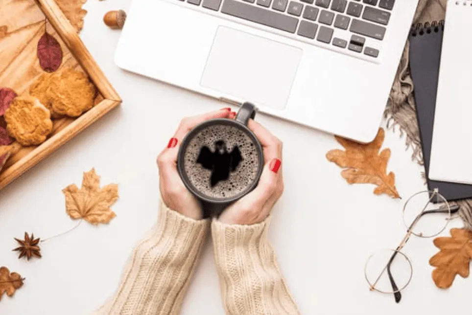 Halloween-themed coffee mug with bat latte art on International Coffee Day – October POD design inspiration