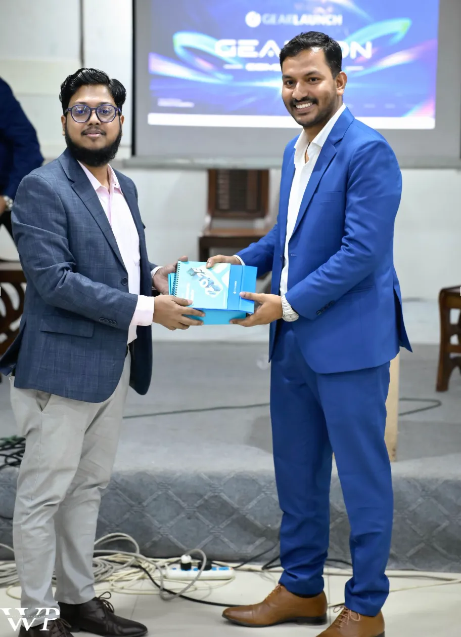 Entrepreneur receiving GearLaunch award on stage at GearCon Comilla 2025 in Bangladesh.