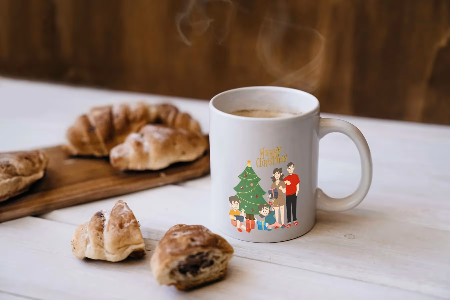 White ceramic mug with a personalized Christmas family design beside croissants — ideal for showcasing customizable holiday gift products.