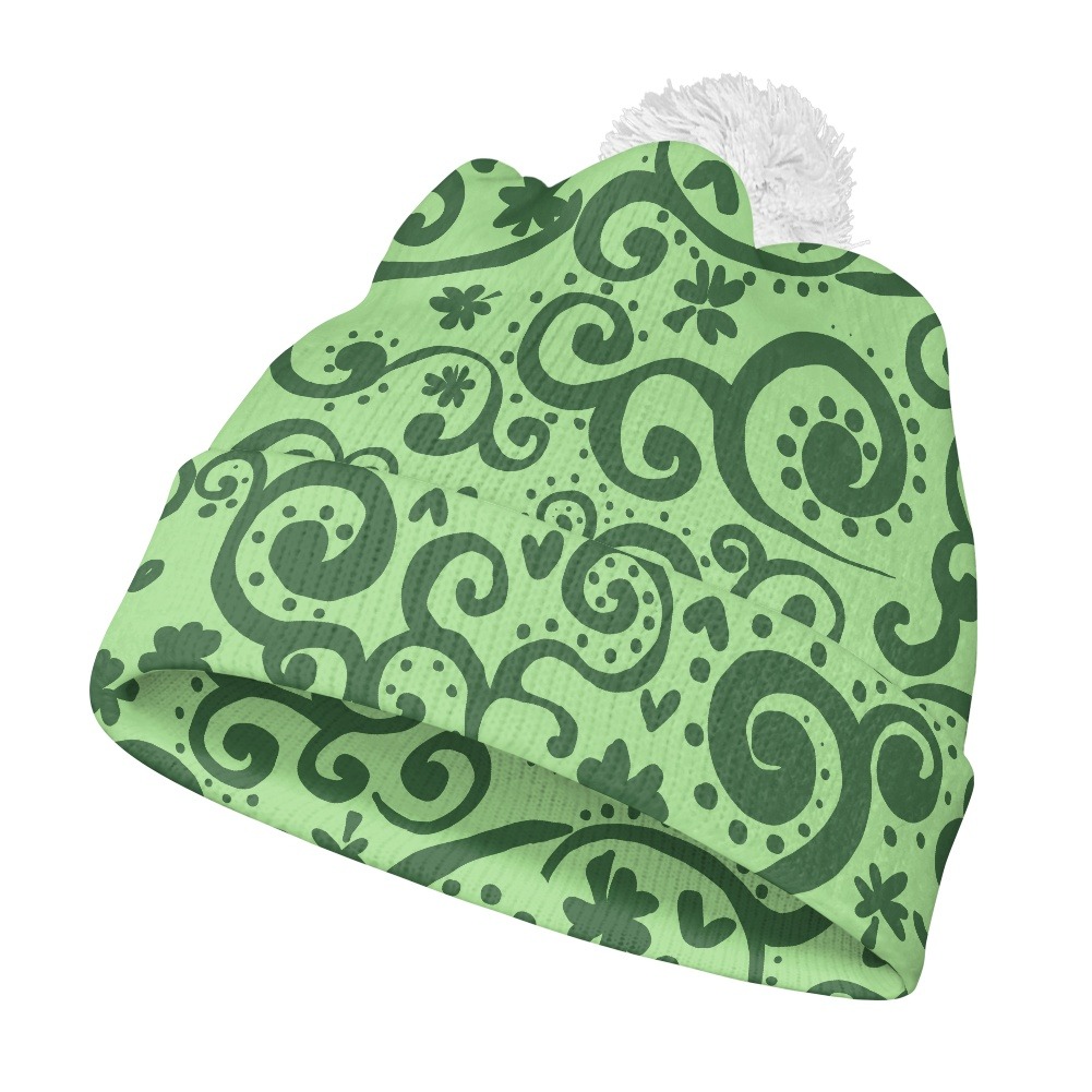 Woolen pom-pom beanie with fold-over cuff and knitted texture.