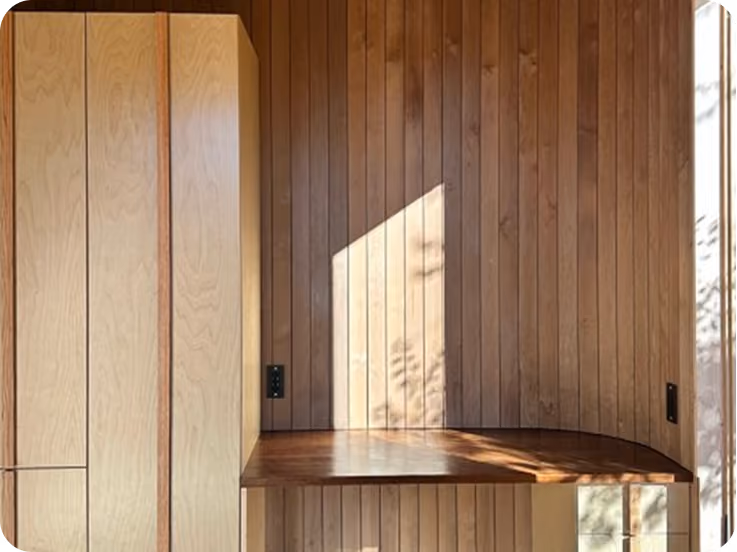Built-in wardrobe and work nook in ELMNTL modular prefab hospitality cabins