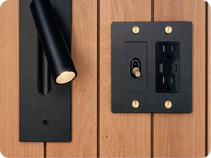 Bedside reading lights and USB connections in ELMNTL modular prefab hospitality cabins